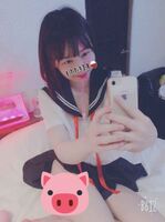 Selfie erotic image of a color-ish girl with a condom that looks good