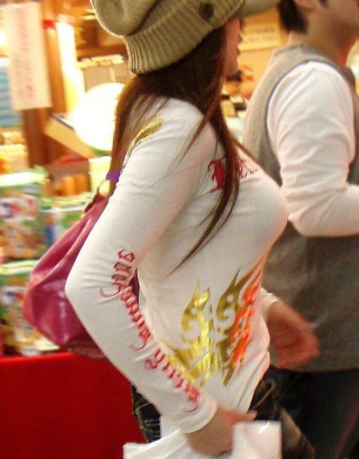 Photograph amateur girls dressed in clothes that look bigger than busty breasts in the city 12th image