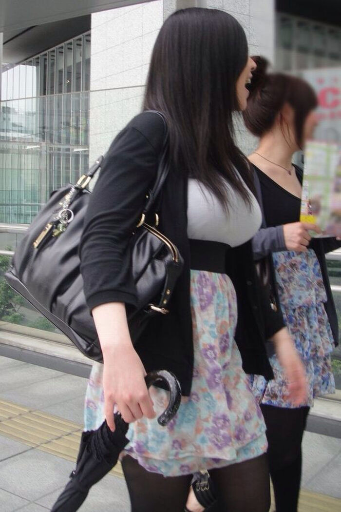 Photograph amateur girls dressed in clothes that look bigger than busty breasts in the city 20th image