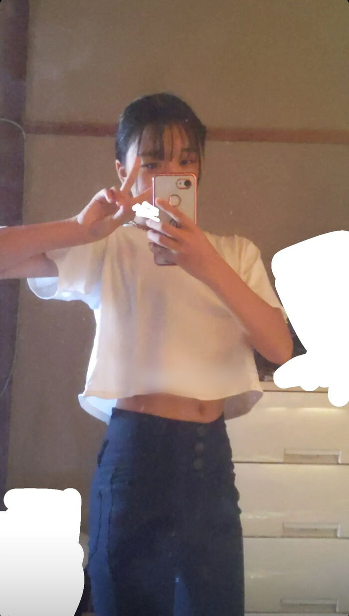 22-year-old female student holding a smartphone with her face and taking a naked hair nude mirror photo 13th image