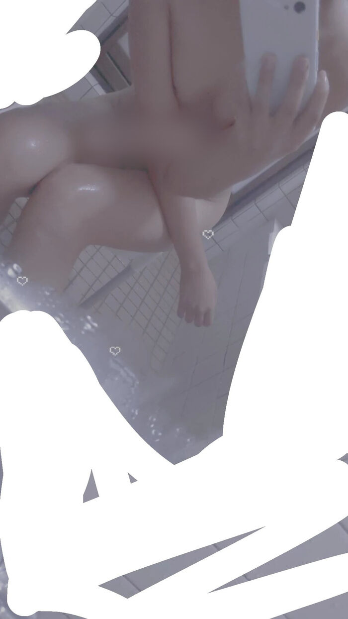 22-year-old female student holding a smartphone with her face and taking a naked hair nude mirror photo 26th image