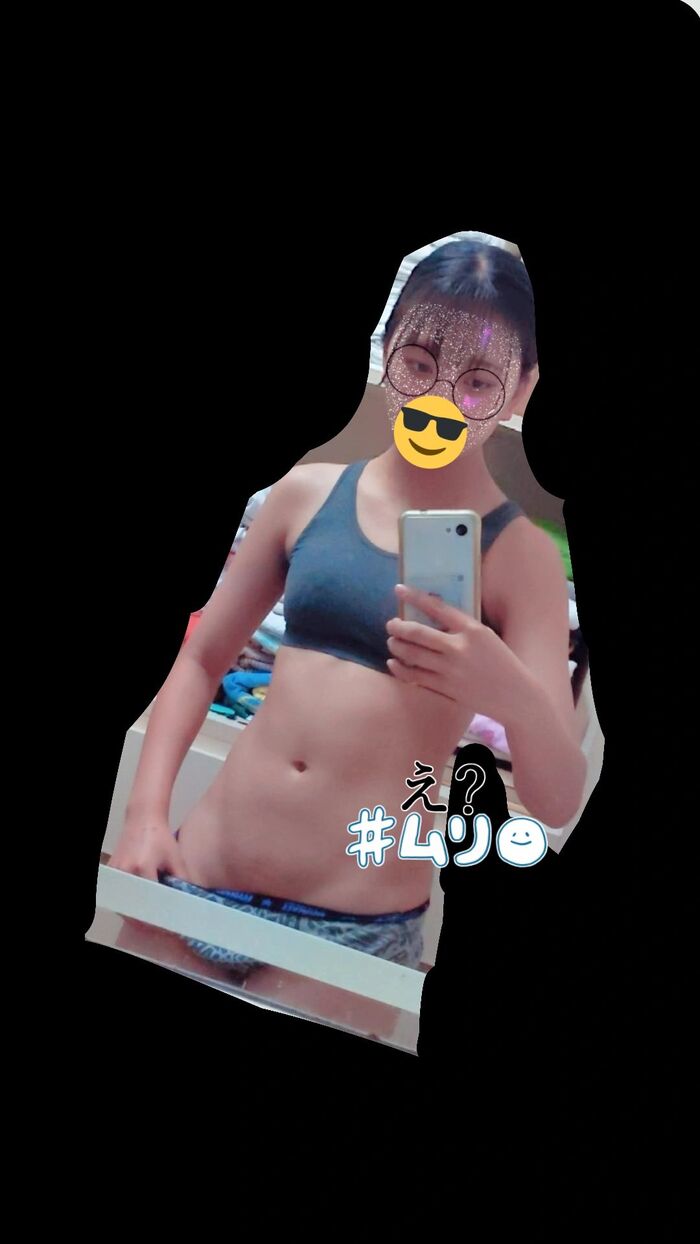 22-year-old female student holding a smartphone with her face and taking a naked hair nude mirror photo 4th image