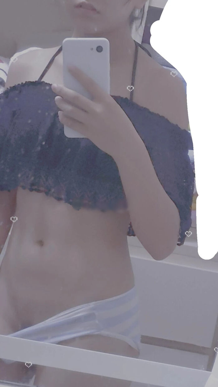 22-year-old female student holding a smartphone with her face and taking a naked hair nude mirror photo 7th image